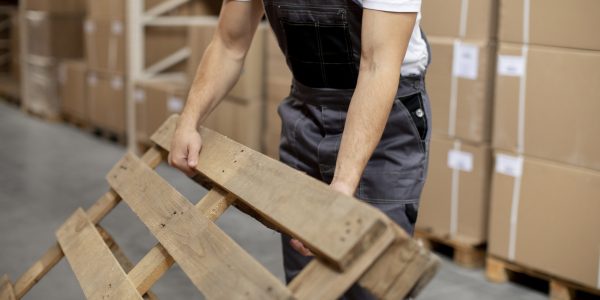 close-up-hands-holding-wooden-item