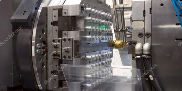 depositphotos_125678980-stock-photo-injection-molding-machines-in-a
